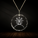 Crystal pendant with engraved symbol AMA'NAA inside