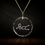 Crystal pendant with engraved symbol AMA'RANUS inside