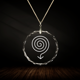 Crystal pendant with engraved symbol ARIS inside