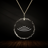 Crystal pendant with engraved symbol ATOROS inside
