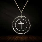 Crystal pendant with engraved symbol JESUS inside