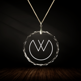 Crystal pendant with engraved symbol DI'TRASO inside