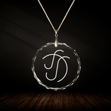 Crystal pendant with engraved symbol ELOO inside