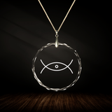 Crystal pendant with engraved symbol ELTA inside