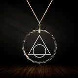 Crystal pendant with engraved symbol EXOLARIS inside