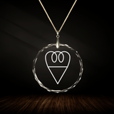 Crystal pendant with engraved symbol MERA inside