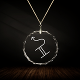 Crystal pendant with engraved symbol NASHA'O inside