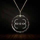 Crystal pendant with engraved symbol NION inside