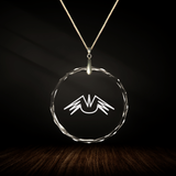 Crystal pendant with engraved symbol NU'A'TRENDA inside