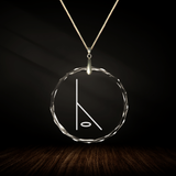 Crystal pendant with engraved symbol NUBI inside