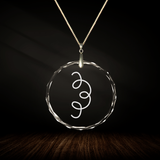 Crystal pendant with engraved symbol SADNA inside