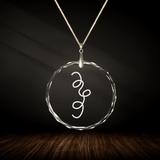 Crystal pendant with engraved symbol SERUS inside