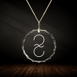Crystal pendant with engraved symbol SIRIUS inside