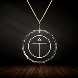 Crystal pendant with engraved symbol TANA'ATARA inside