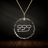 Crystal pendant with engraved symbol YA'NA inside